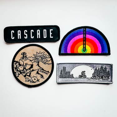 Woven patch and 3x stickers.